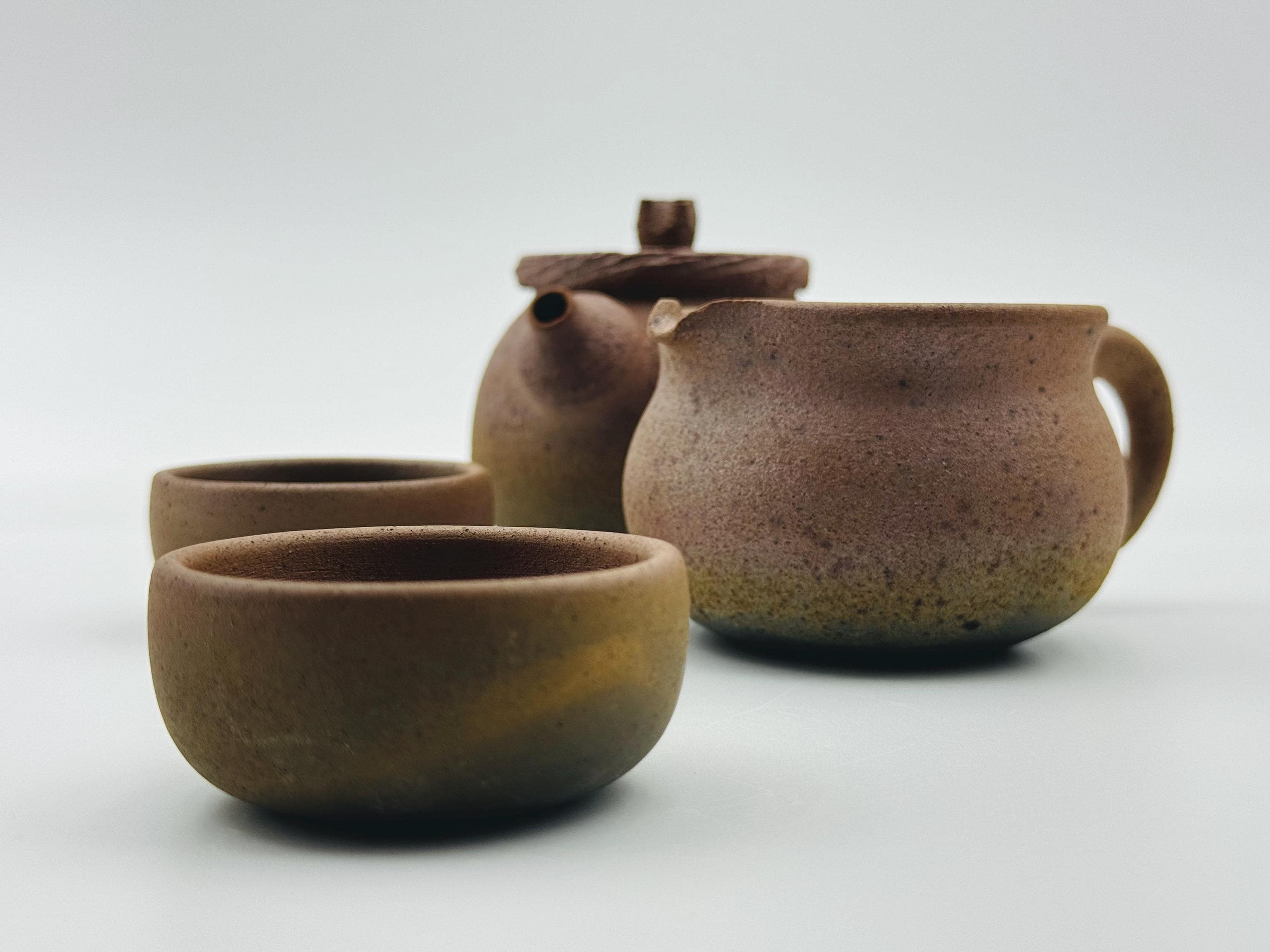 Handcrafted Ceramic Tea Cup: Unglazed Mantou Kiln, Earthy Tones
