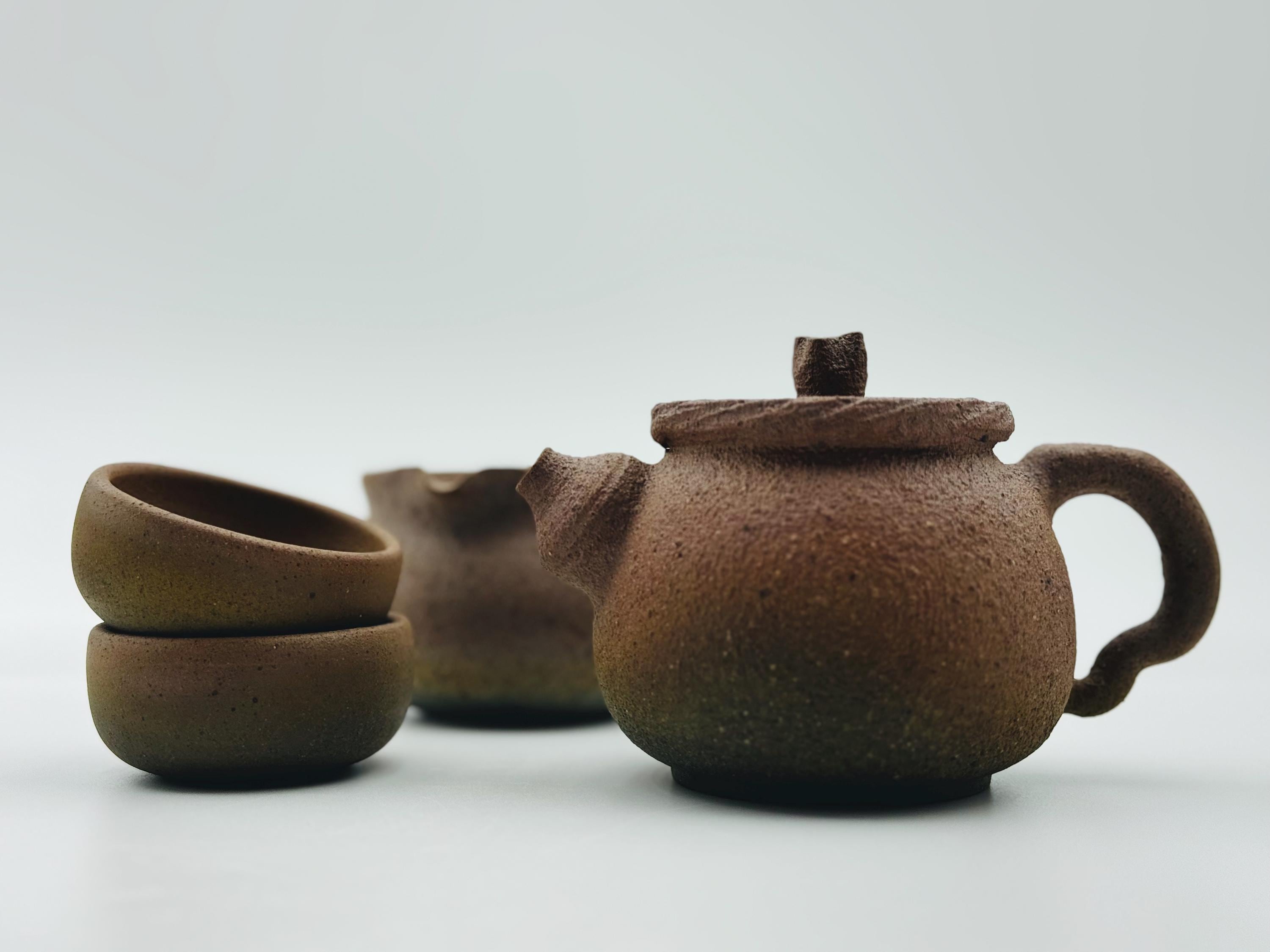 Handcrafted Ceramic Tea Cup: Unglazed Mantou Kiln, Earthy Tones